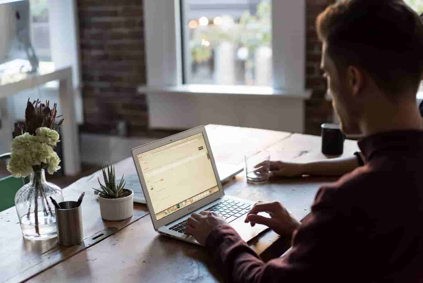 Image | Person at desk using a laptop